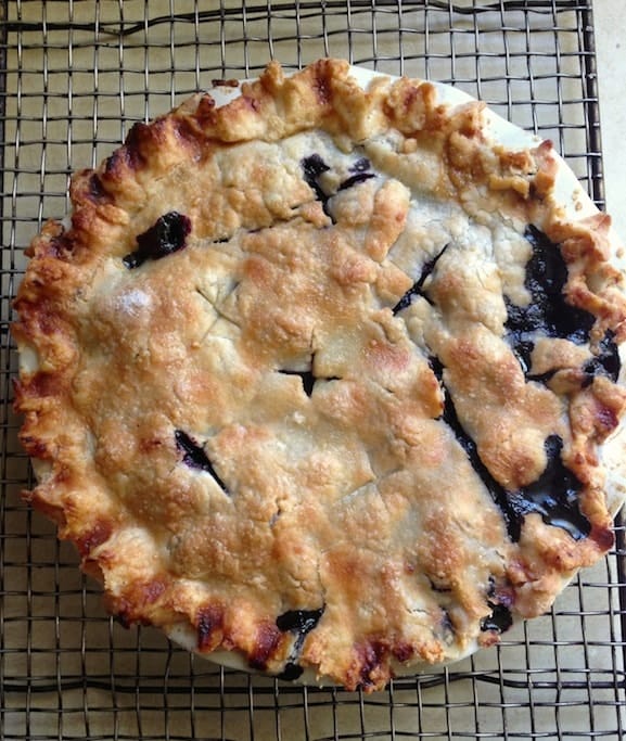 Gluten-Free Blueberry Pie cooling on a wire rack.