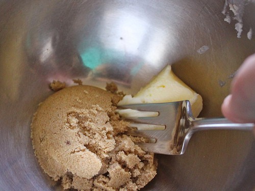 Mixing brown sugar and butter together for gluten-free cinnamon waffles.