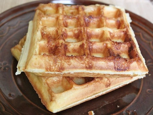 Gluten-Free Cinnamon Bun Waffles on brown plate.