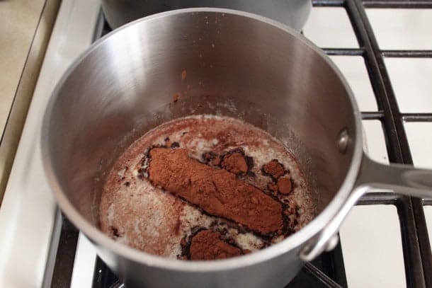 Ingredients for gluten-free cola cake syrup in pan.