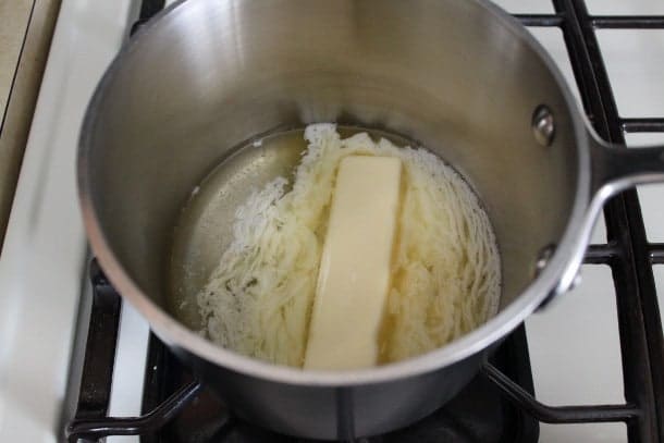 Melting butter for gluten-free cola cake.