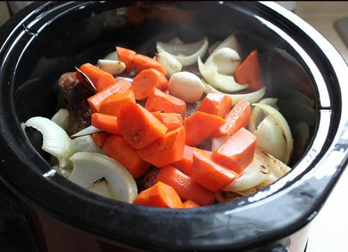 Paleo pot roast ingredients in slow cooker.