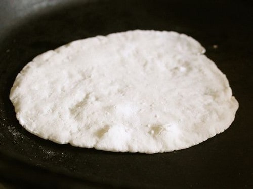 Gluten-Free Flour Tortillas in a skillet cooking.