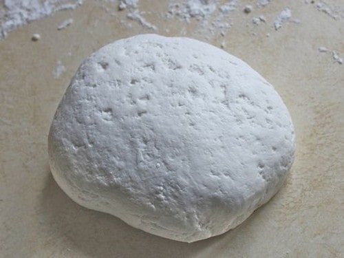 Gluten-Free Flour Tortilla dough ball on counter.