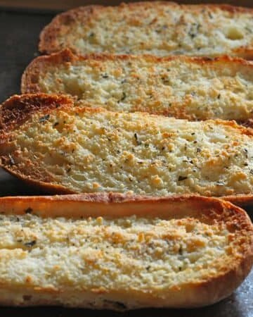 Gluten-Free Garlic Bread on baking pan.