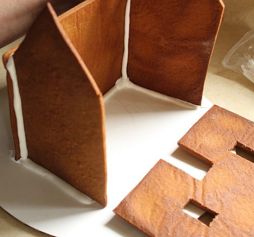 Putting together a gluten-free gingerbread house.