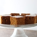 Gluten-Free Ginger Pumpkin Bread on a glass cake stand.