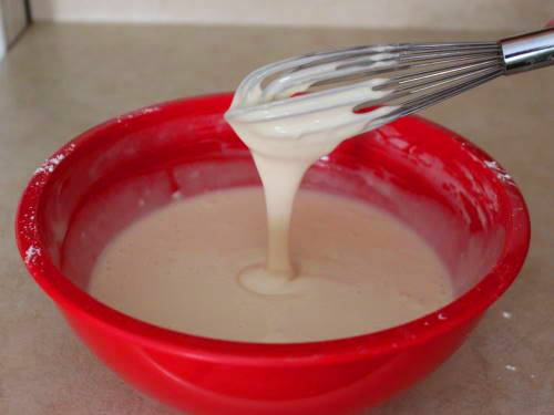 Gluten-free pancake batter in red bowl.