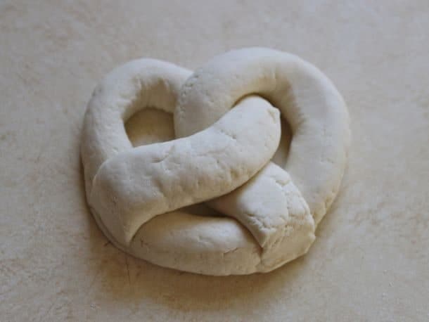 Gluten-Free Soft Pretzel dough shaped into a pretzel.