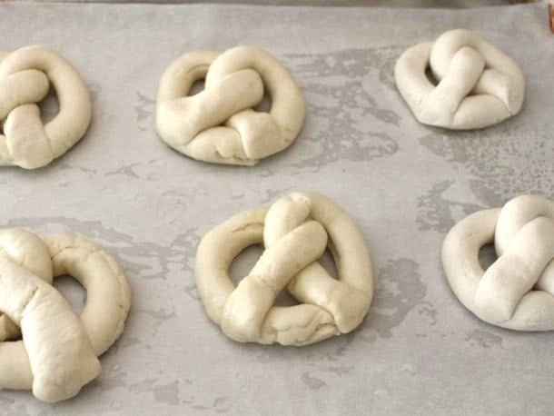 Gluten-Free Soft Pretzel dough shaped on a baking sheet.