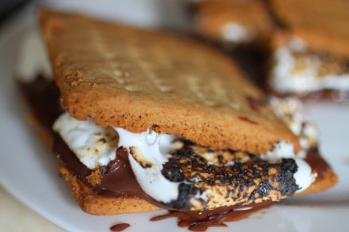 Gluten-Free Graham Crackers made into a s'more with marshmallow and chocolate.