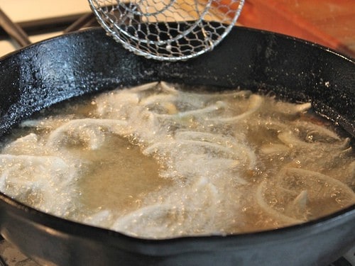 Frying onions for gluten-free green bean casserole.