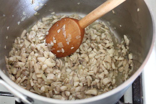 Cooking chopped mushrooms for green bean casserole.