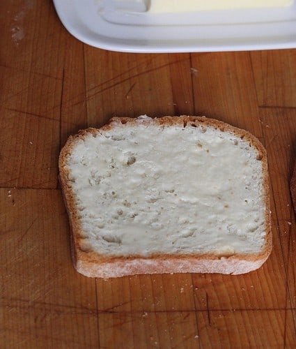 Buttered slice of gluten-free bread.
