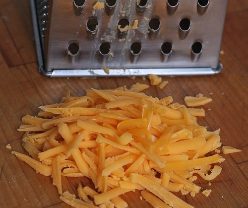 Grated cheese for gluten-free grilled cheese.