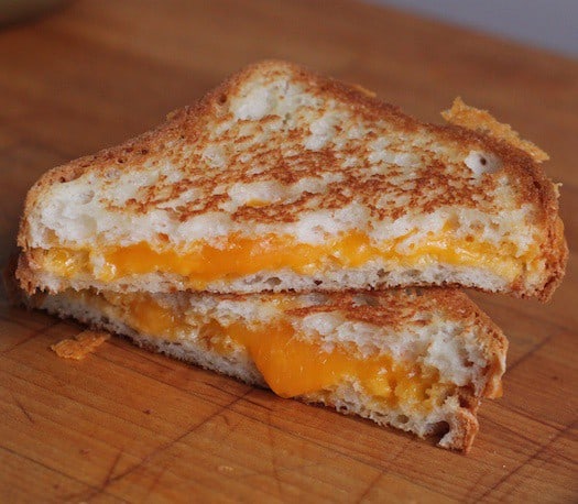 Gluten-free grilled cheese on a cutting board.