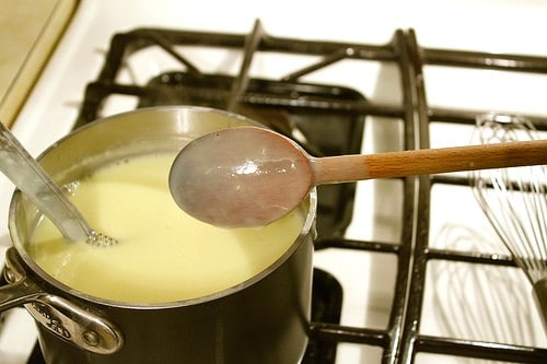 Cooking eggnog on the stove.