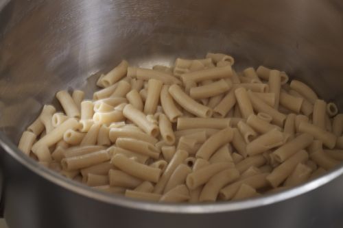 Cooked gluten-free pasta in a pot.