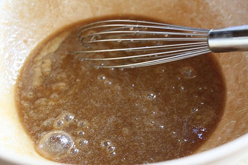 Whisking sugar and eggs together for gluten-free brownie batter.