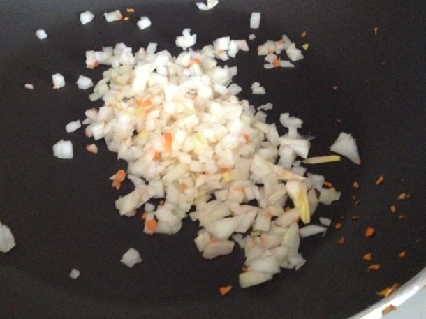 Cooking onions for gluten-free spinach dip.