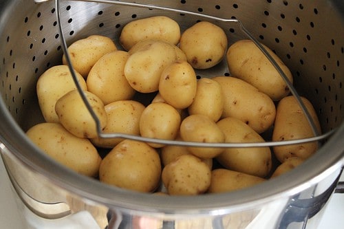 Potatoes in steamer basket.