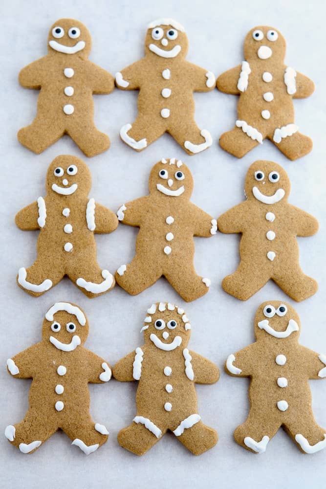 Gluten-free gingerbread cookies on a piece of parchment paper.