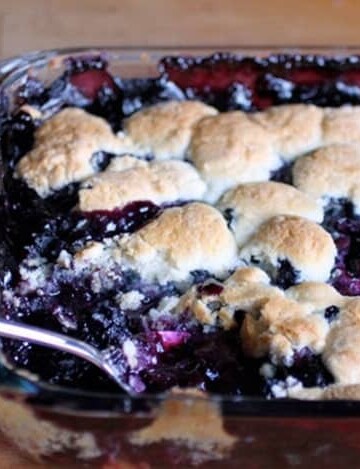 Gluten-Free Blueberry Cobbler in glass pan.