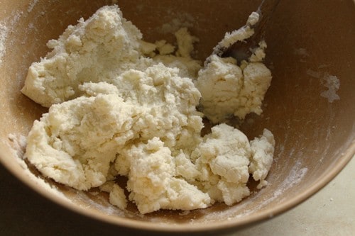 Gluten-free cobbler dough in a wood bowl.