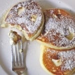 Gluten-Free Cheesecake Pancakes on a white plate.
