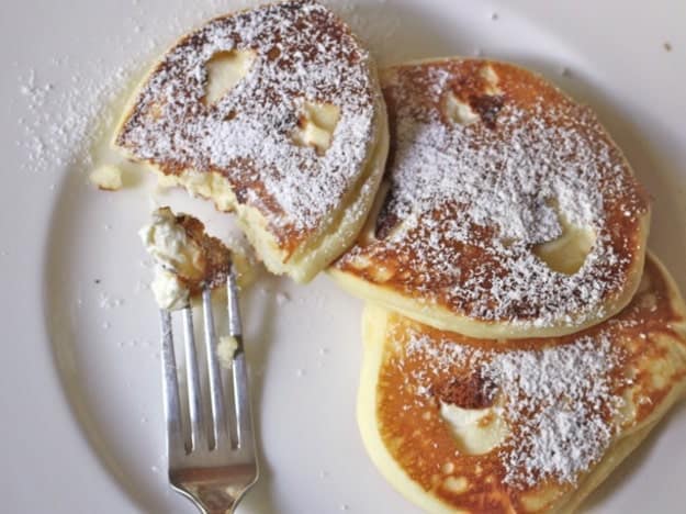 Gluten-Free Cheesecake Pancakes on a white plate.