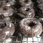 Baked gluten free chocolate doughnut on cooling rack