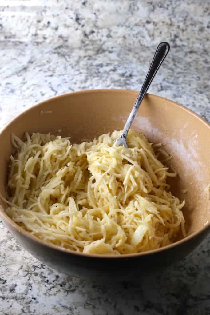 Gluten-Free latkes mixture in a brown bowl. 