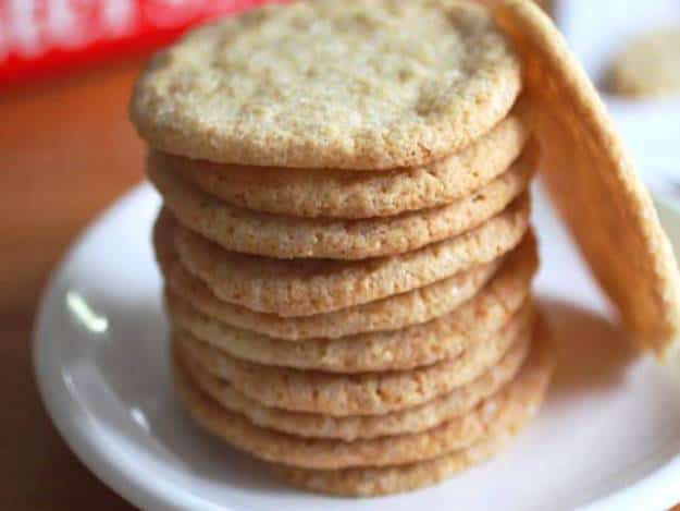 Stack of gluten-free sugar cookies on a white plate.