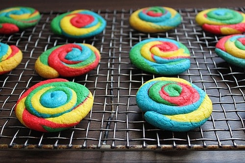 Baked gluten-free tie dye cookies cooling on a wire rack.