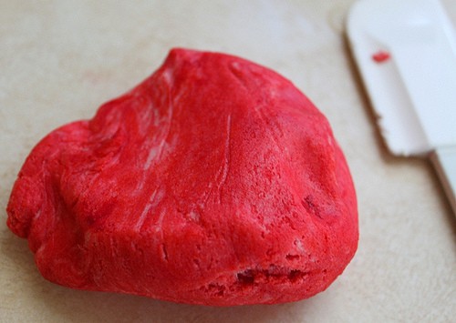Gluten-free cookie dough ball dyed red.