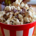 White chocolate popcorn with cranberries in a bowl.