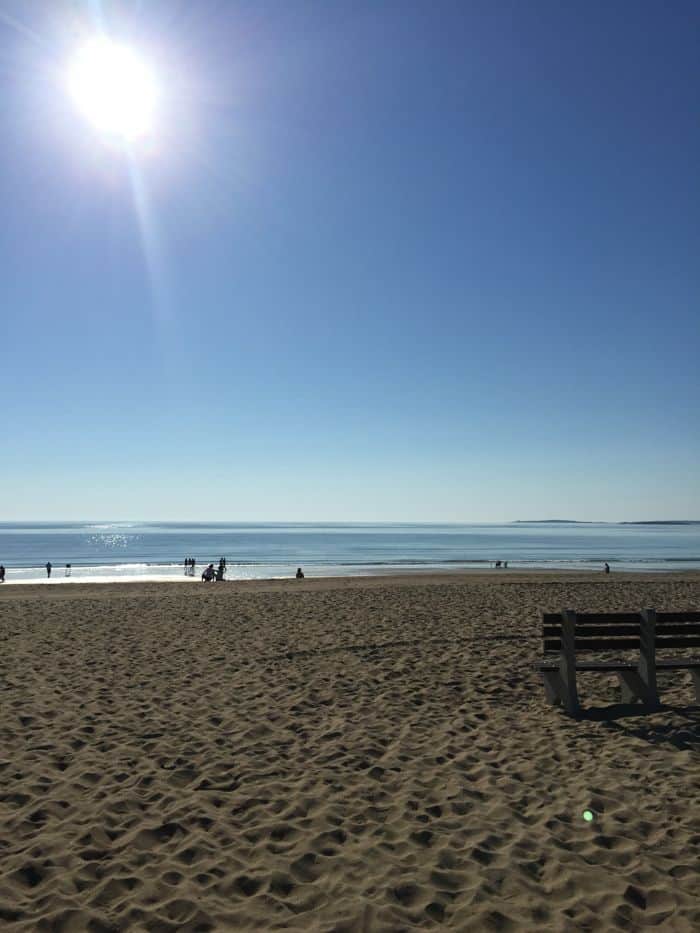 Blue sky and an empty beach in Old Orchard Beach, Maine.