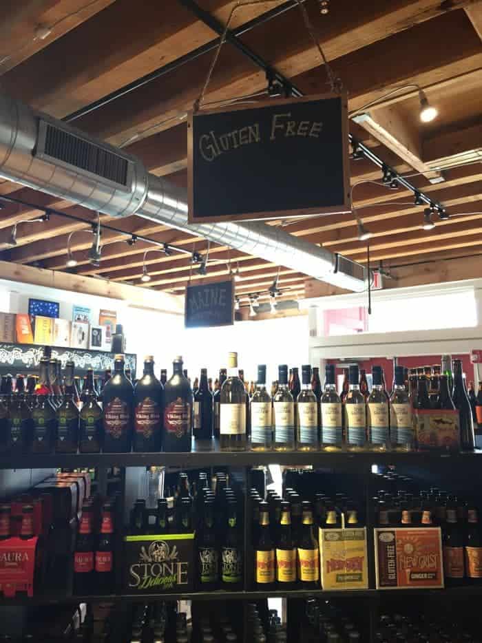 Gluten-free sign over wine display.