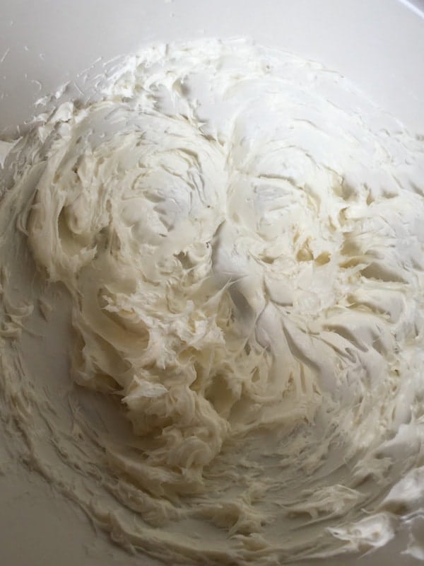 Cream cheese frosting in mixing bowl.
