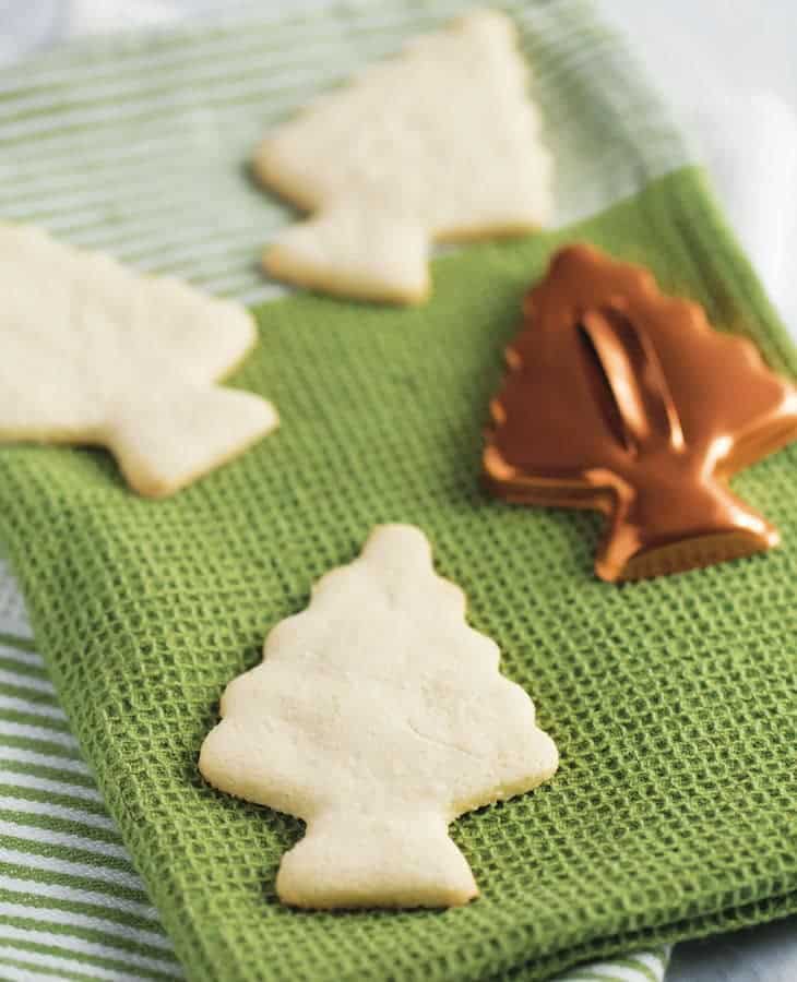 Paleo cut out sugar cookies in the shape of a tree.