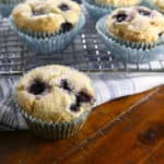 Gluten-Free blueberry muffins on wire rack.