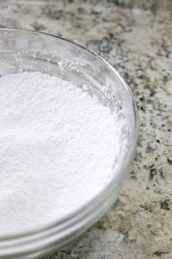 Corn-free powdered sugar in glass bowl.