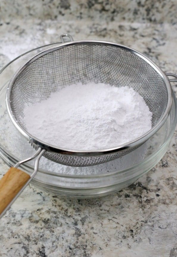Sifting corn-free powdered sugar.