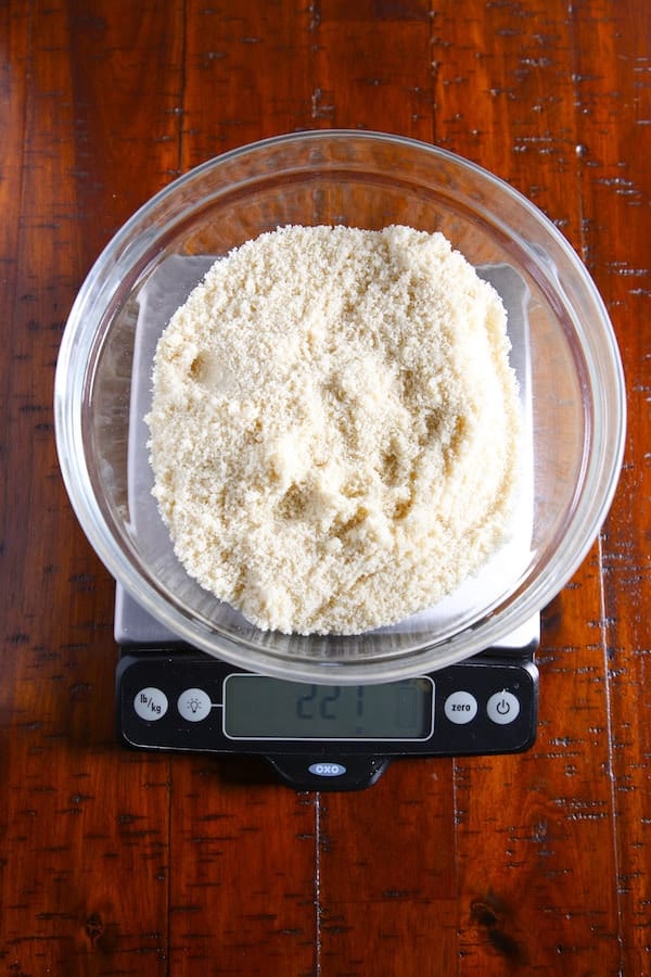 Almond flour in bowl on digital scale.