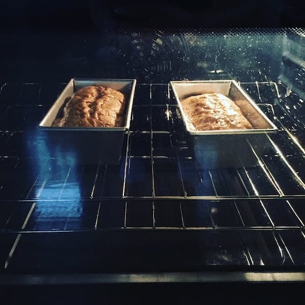 Gluten-free zucchini bread baking in oven.