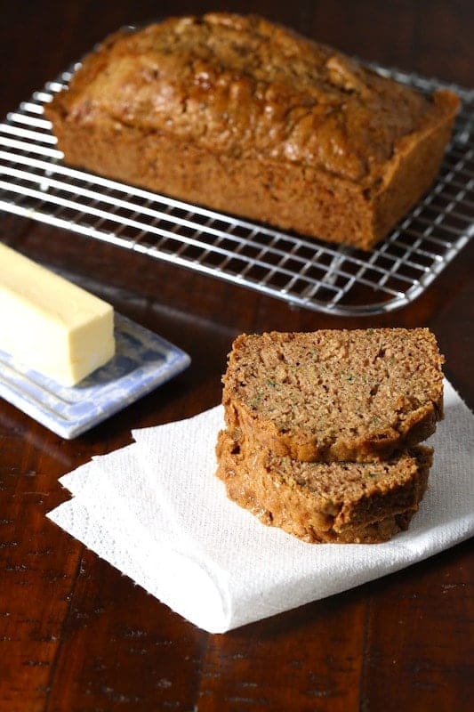 Gluten-free zucchini bread cooling on a wire rack.