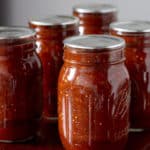 Homemade chipotle salsa in jars.