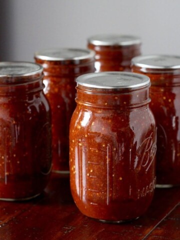 Homemade chipotle salsa in jars.