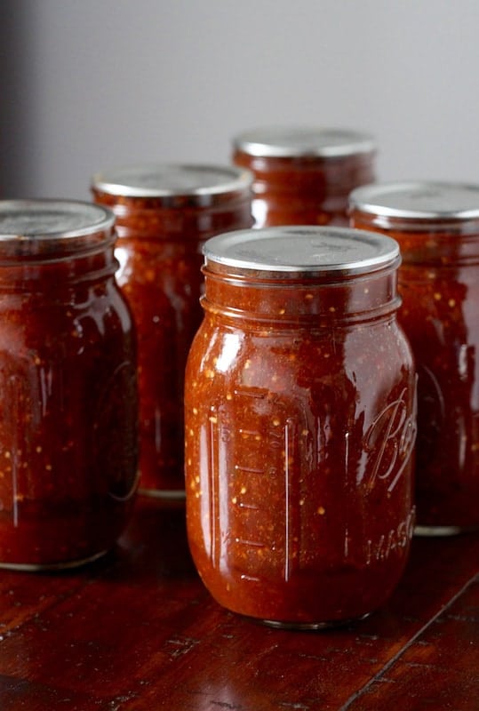 Homemade chipotle salsa in jars.