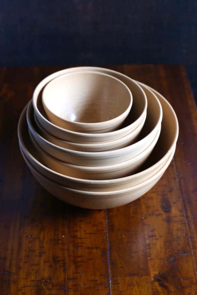 Stack of brown mixing bowls.